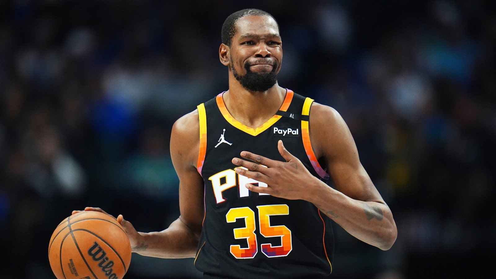 Phoenix Suns forward Kevin Durant gestures during the second half of an NBA basketball game